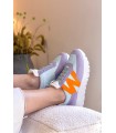 Deportivo para mujer combinado en color turquesa y naranja