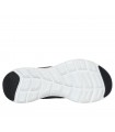 Deportivo Skechers en color negro con cierre de cordones y suela blanca.