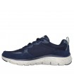 Deportivo Skechers de corte clásico en color azul marino con suela beige.