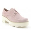 Zapatos de color rosa con suela blanca